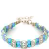 PULSEIRA PRATEADA CONTAS E PLACAS - TURQUESA